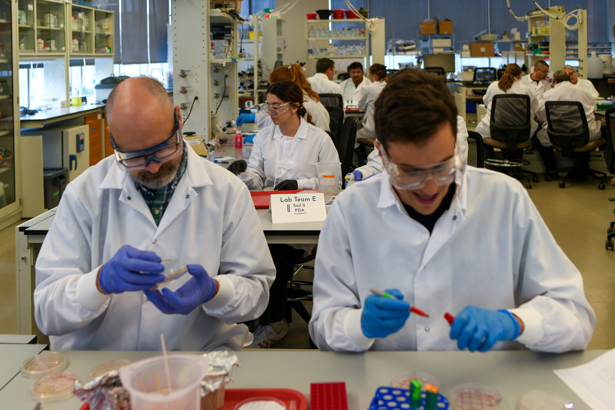 Training participants practice Tiny Earth protocols in the lab