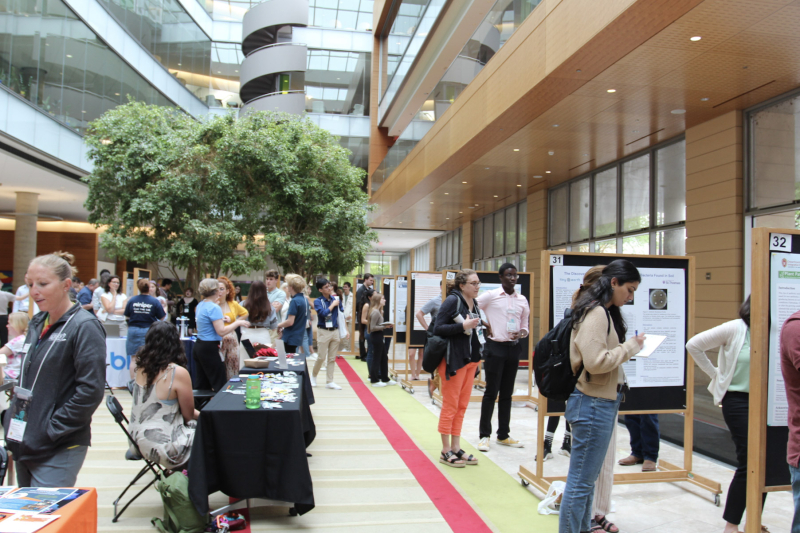 Students and attendees at the Tiny Earth Summer Symposium in the Wisconsin Institute for Discovery atrium