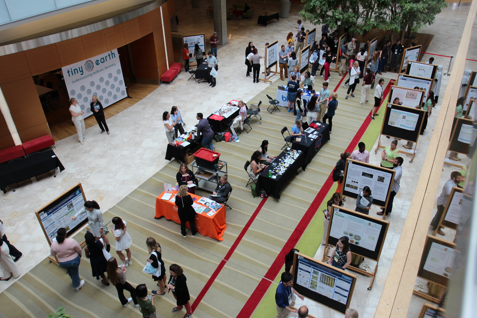 Students and instructors networking with academic and industry representatives