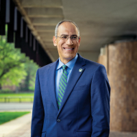 Chancellor Mike Alexander stands outside Rose Hall on the UW-Green Bay, Green Bay campus. Photo taken by Image Studios, Inc.