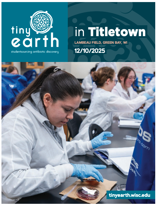 Cover of the Tiny Earth in Titletown Symposium booklet. A student researcher in a white lab coat smiles and looks at the camera while pipetting into a microcentrifuge tube.